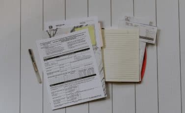 stack of papers flat lay photography